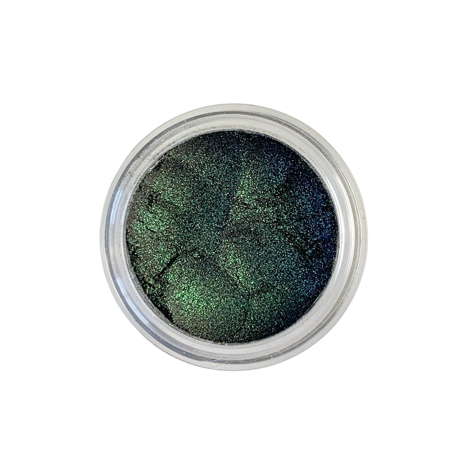 astral eyeshadow - green glitter on a base of dark eyeshadow. vegan and cruelty free. 2 grams.
